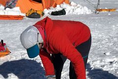 04C Guide Pachi Demonstrating How To Place The Wag Bag In The Toilet Bucket At Mount Vinson Low Camp.jpg